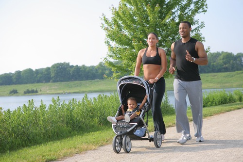 Couple runs with baby stroller