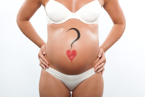 Pregnant woman with question mark