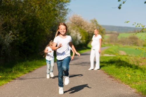 Children and mother walking outdoors