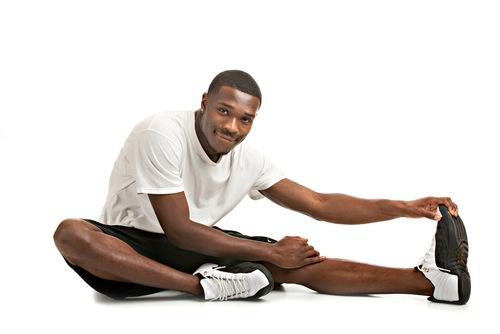 Healthy young man exercises