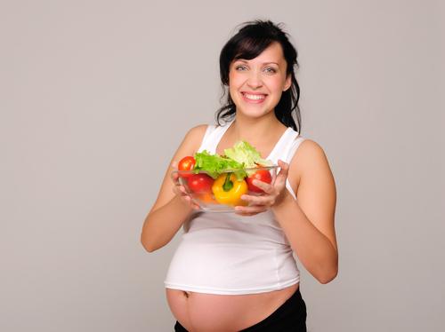 Pregnant Woman Holding Food