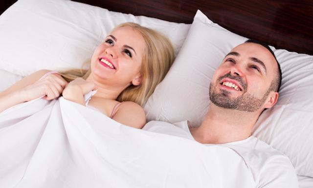 man-and-woman-in-bed-smiling
