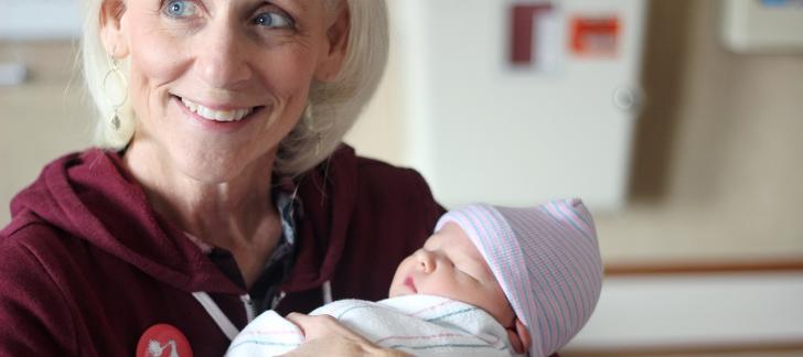 mother-in-law-grandmother-holding-newborn-baby