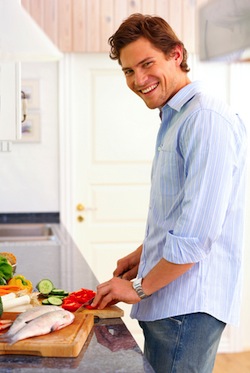 man cooks healthy food 