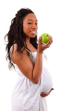 Pregnant eating apple