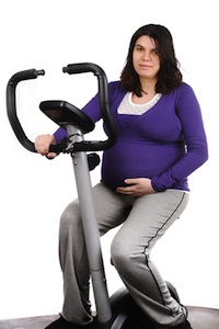 Pregnant woman on stationary bike